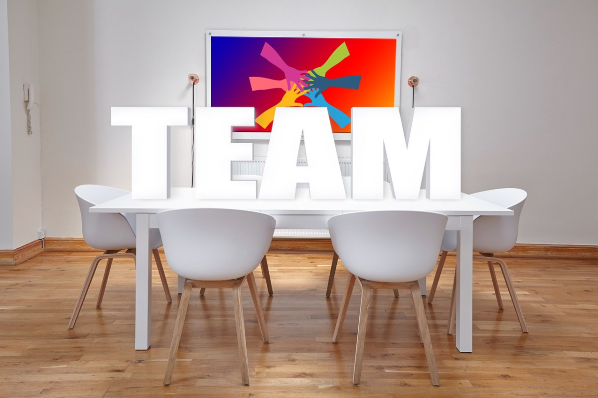 Stock image of the word team in an office to advertise Diverse Directions, a dedicated team of professional language therapists, educational psycologists and clinicak psychologistss